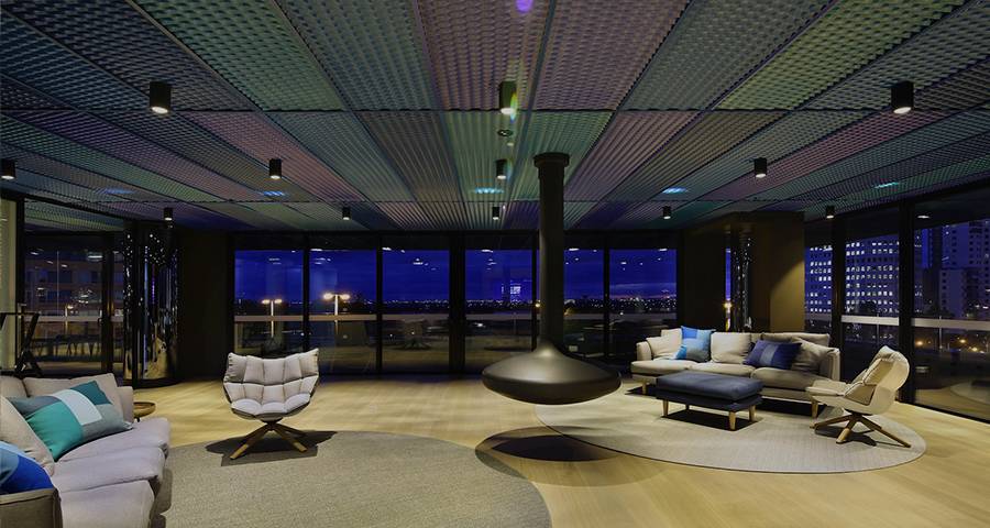 Multi-coloured expanded metal ceiling installed on the roof of the lounge area