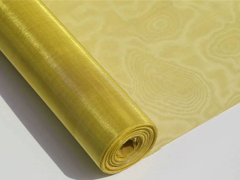 A roll of unrolled brass wire mesh