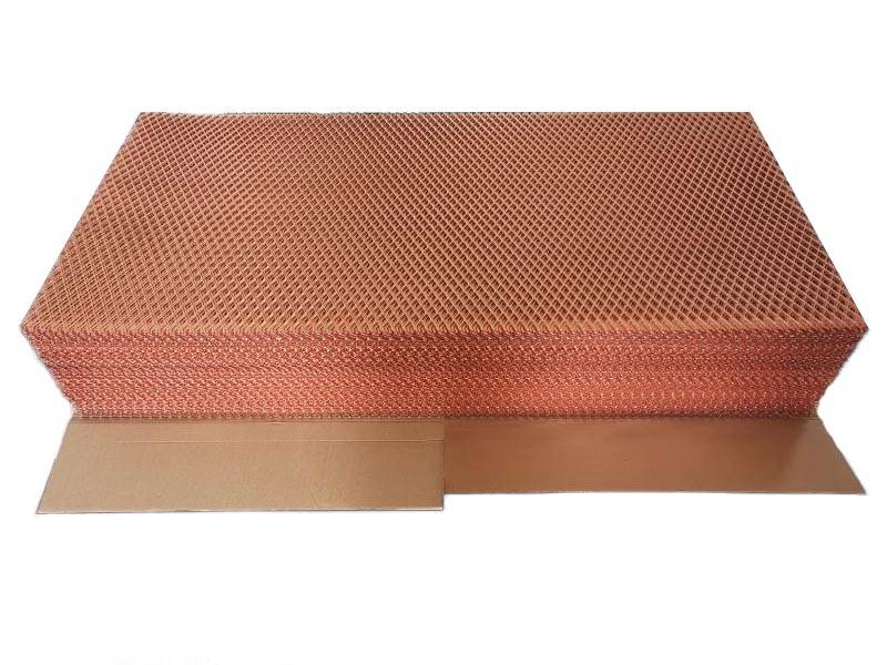 Copper expanded metal sheet arranged neatly on cardboard