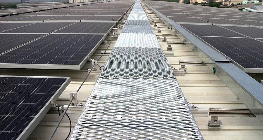 Expanded metal grating walkway is installed in the middle of the solar panel