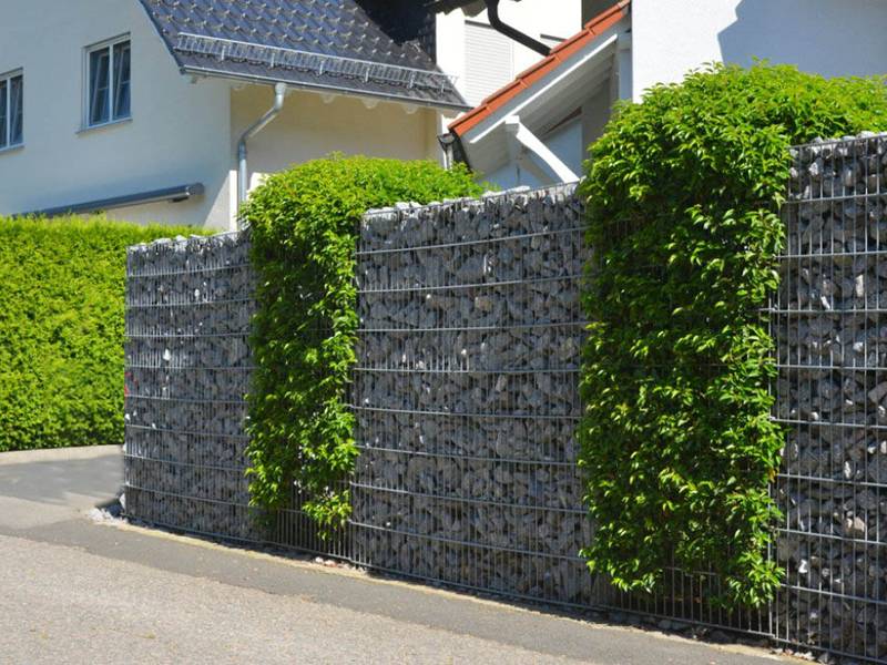 Welded gabion mesh walls with green plants in the villa area