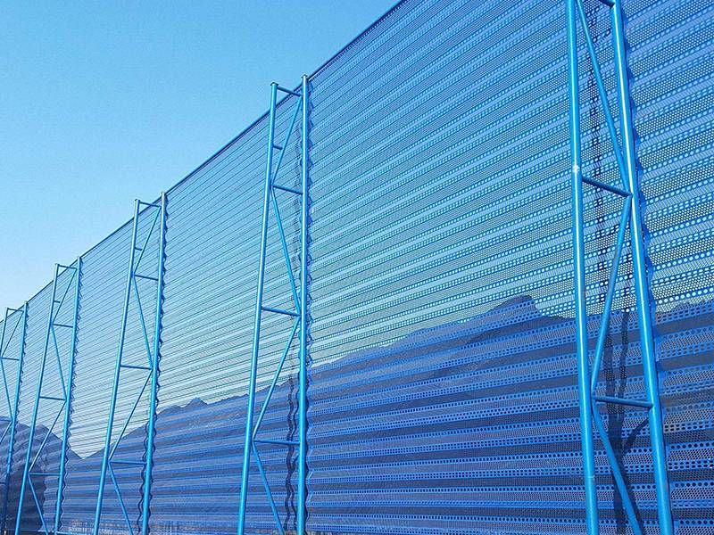 Perforated metal windbreak panel fence