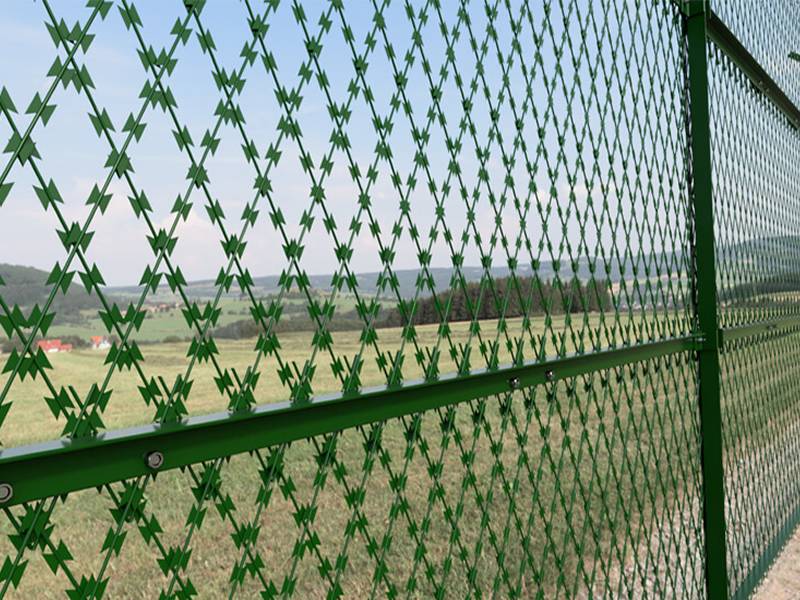Welded razor wire mesh fence on grassland